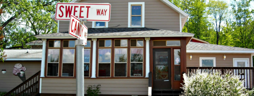Sweet Memories Candy Shoppe storefront in summertime.